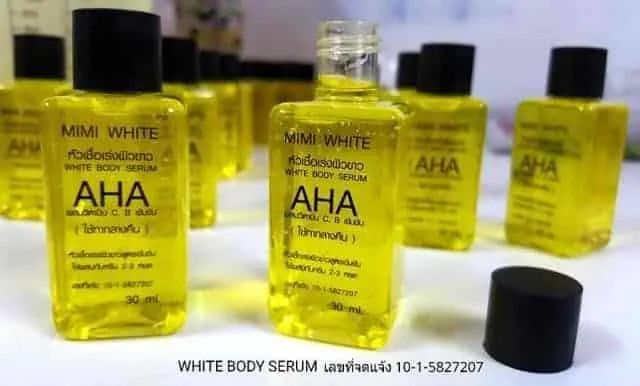 Open bottles of Mimi White Aha Mini Serum