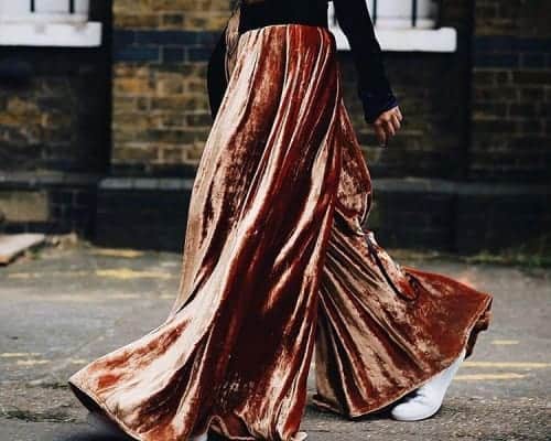 Liz Uy wearing a velvet top and pleated velvet pants