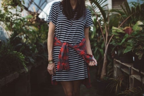 Girl in navy blue and white striped dress