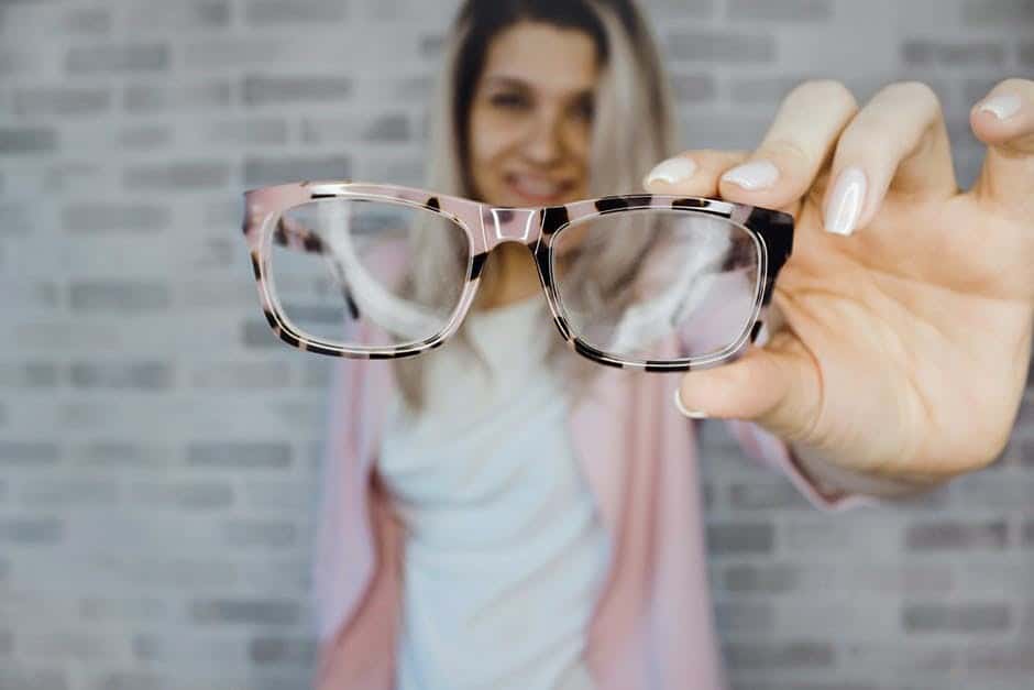 blonde with pink and black glasses